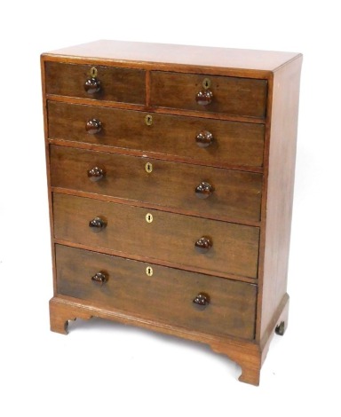 A 19thC oak chest, of two short and four long drawers, with bun handles and brass escutcheons, on bracket feet, 121cm high, 91cm wide, 48cm deep.