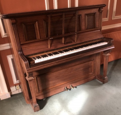 A Victorian rosewood overstrung upright piano, 134cm high, 159cm wide, 66cm deep.