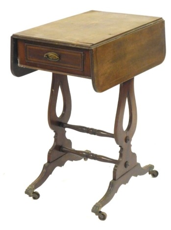 A mahogany sewing table, with two fall flap on harp ends support, with single drawer, terminating in castors, 72cm high, 54cm wide, 36cm deep.