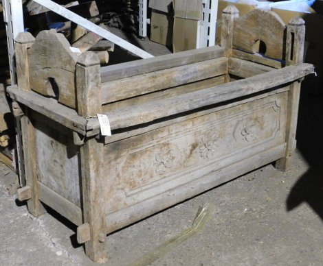 By Tender. A Javanese hardwood chest, of rectangular form, with raised shaped sides and carved floral front panel, lacking lid, 66cm high, 107cm wide, 47cm deep. RRP £500. Note: VAT is payable on the hammer price of this lot at 20% in addition to Buyer's 