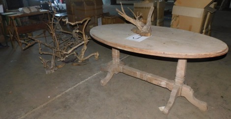 NOT SOLD, no bids. A reclaimed hardwood Victorian style table, together with a quantity of driftwood. Note: VAT is payable on the hammer price of this lot at 20% in addition to Buyer's Premium. Collection is by appointment Monday 19th & Tuesday 20th Decem