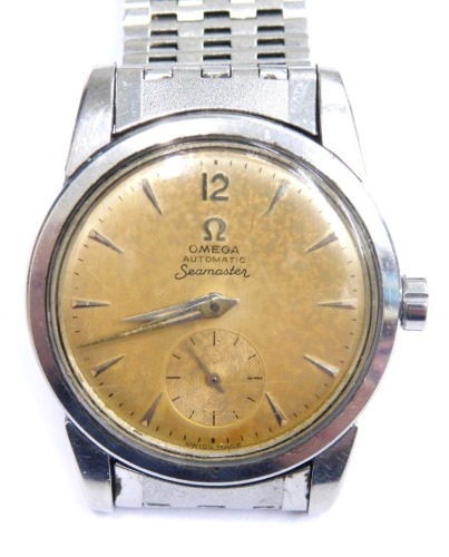 An Omega Seamaster gentleman's wristwatch, with a brown/yellow coloured dial and seconds dial, on a stainless steel strap, 3.5cm diameter.