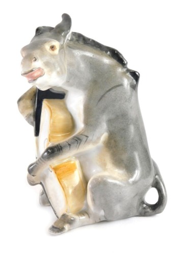 A 1940s Lomonosov porcelain figure of a donkey playing the cello, part of the famous quartet, marked EP beneath, 15cm high.