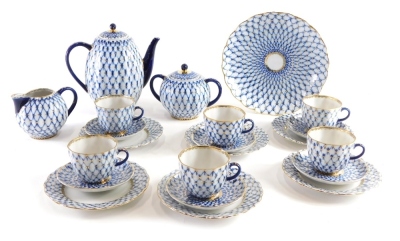 A late 20thC USSR fishnet patterned 24 piece coffee service, to include side plates 17cm wide, with gilt highlights, marked beneath. (24)