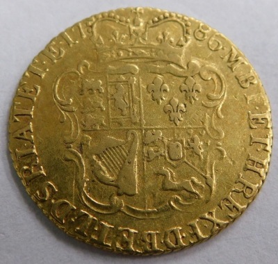 A George III half rose shield guinea, 1786. - 2