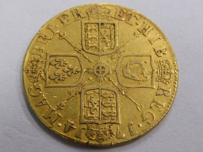 A Queen Anne gold guinea, 1714, crowned cruciform shield back. - 2