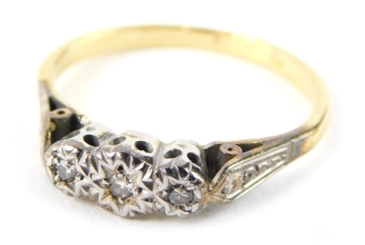 A 1920/30s diamond set dress ring, with three star points, with an illusion set tiny diamonds, with platinum shoulders on a yellow metal band, unmarked, ring size L, 2.3g all in, boxed