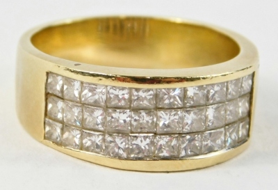 A half hoop diamond dress ring, set with three rows of square cut diamonds, each approx 0.2ct, band stamped 750, ring size R,