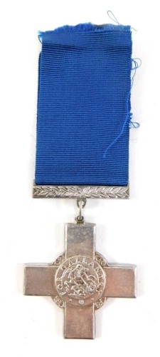 A reproduction George cross, with ribbon, 6cm high.