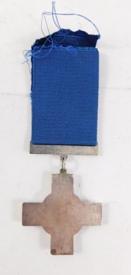 A reproduction George cross, with ribbon, 6cm high. - 2