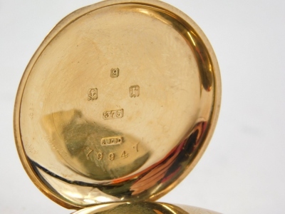 A 9ct gold cased fob watch, with a white enamel Roman numeric dial, with gold hands and seconds border, with bezel wind, 3cm diameter, 31.6g all in. - 2