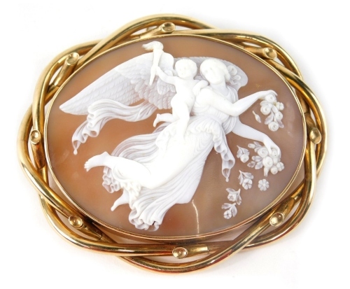 A 19thC shell cameo brooch, depicting an angel and cherub holding torch in a twist frame outer border, with pendant loop and single pin back, the cameo signed L Balbi, Roma, in yellow metal, unmarked, 8cm x 7cm, 26.7g all in.