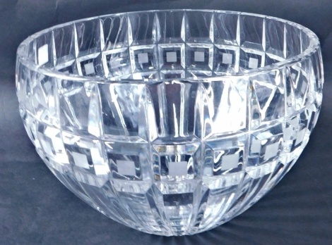 A crystal bowl, of tapering circular form, with a repeat decoration, marked beneath with Waterford label, 24cm diameter.