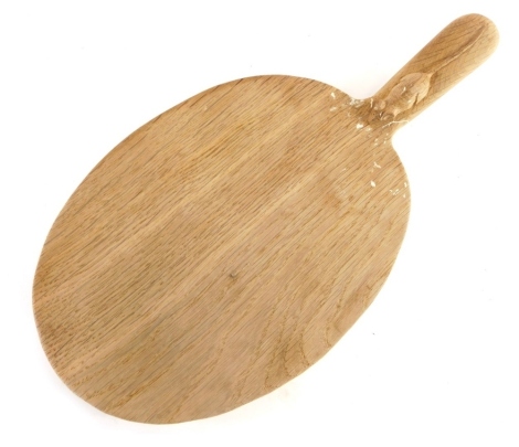 A Robert Mouseman Thompson of Kilburn light oak cheese board, with carved mouse handle, 39cm long.