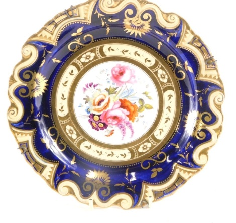 A 19thC cabinet plate, in the manner of Coalport, centred with hand painted flowers on a blue and white ground with gilt highlights, unmarked, 21cm wide.