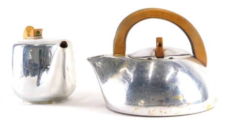 An unusual Picquot ware kettle, with wooden handle and removable lid, marks beneath, 17cm high, and a further teapot. (2)