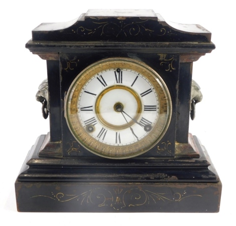 A Victorian slate and marble mantel clock, with 13cm diameter Roman numeric dial, flanked by lion mask, handles on a stepped base, with an eight day movement, 28cm high.