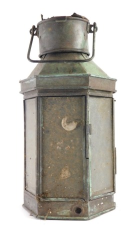 A 20thC ships lantern, with front opening, and swing handle, the main body 47cm high.