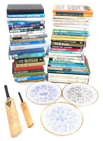 A quantity of cricketing books, to include the autobiography of Johnny Wardle, etc., two miniature bats, one bearing signatures, Donald Bradman books, and three Coalport limited edition collectors plates for Colin Cowdrey, John Edrich and Geoffrey Boycott