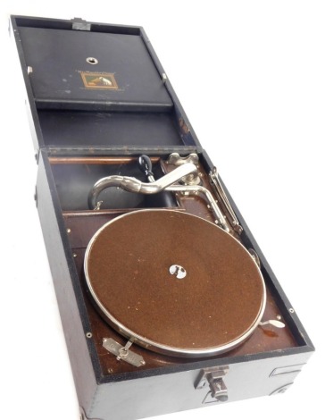 A mid 20thC HMV gramophone, with 25cm diameter chrome and baize lined turntable, chrome arm in pressed leather case, 16cm high.