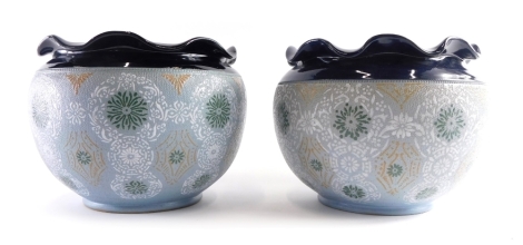 A pair of Langley pottery jardinieres, each with flared rims decorated with repeat floral pattern, impressed marks beneath, 18cm high.
