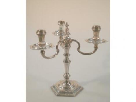 A modern silver three-branch candelabra