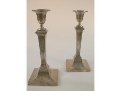 A pair of George V silver candlesticks by James Deakin & Sons