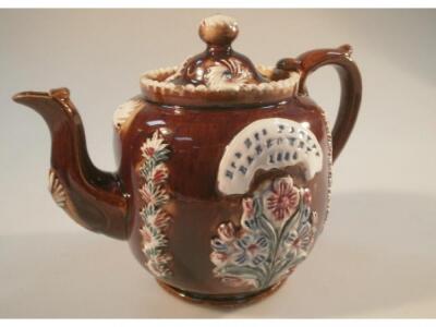 Grantham Interest. A barge ware teapot with applied decoration stamped Mr & Mrs Parker