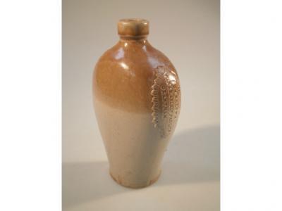 Grantham Interest. A 19thC stoneware beer bottle with applied maker's stamp