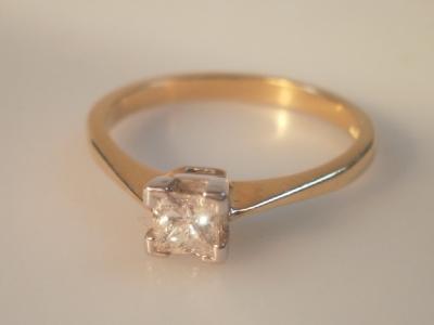 A diamond solitaire ring