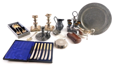 Various silver plated ware, other metalware, etc., an early pewter plate, 27cm diameter, silver plated egg cruet set, sauce boat, pewter hip flask, pair of squat candle sticks, etc. (a quantity)