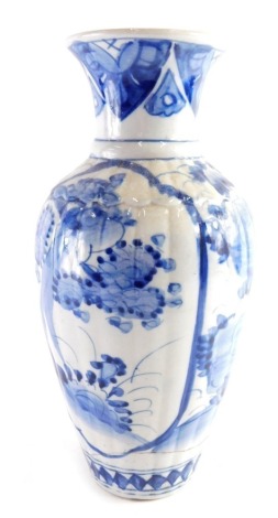 A 19thC Chinese blue and white vase, of shouldered partial ribbed form, decorated with panels of blossoming trees, with a repeat lower diamond pattern, unmarked, 32cm high.