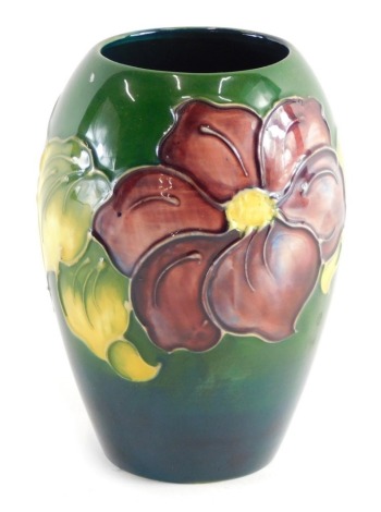 A Moorcroft Anemone pattern vase, of shouldered form, on green ground, impressed marks beneath, 14cm high.