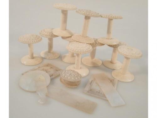 A collection of ten bone cotton reel holders